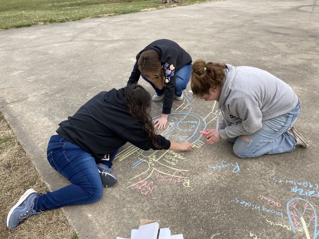 students write with chalk